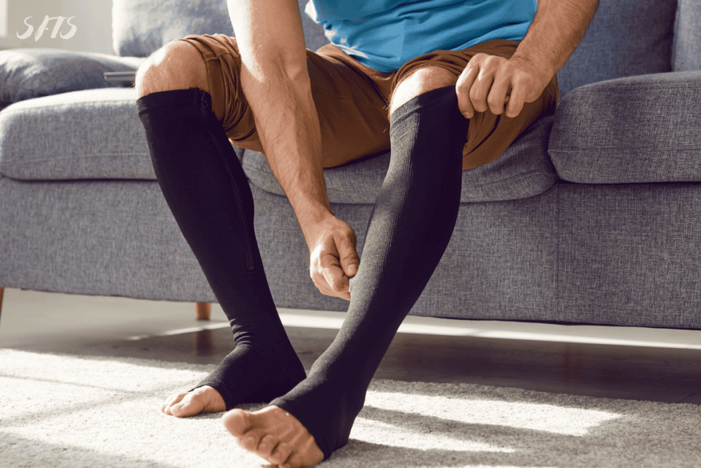 An image of a man wearing black compression stockings.
