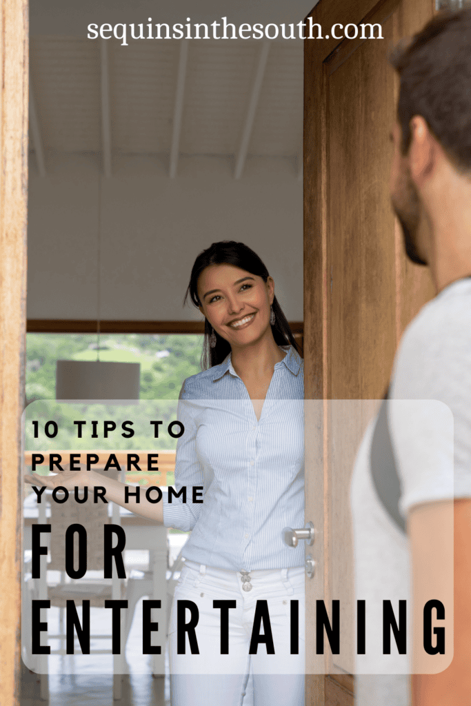 An image of a woman welcoming a man to her home with the text - Ten Tips to Prepare Your Home for Entertaining. The site's link is also included in the image.